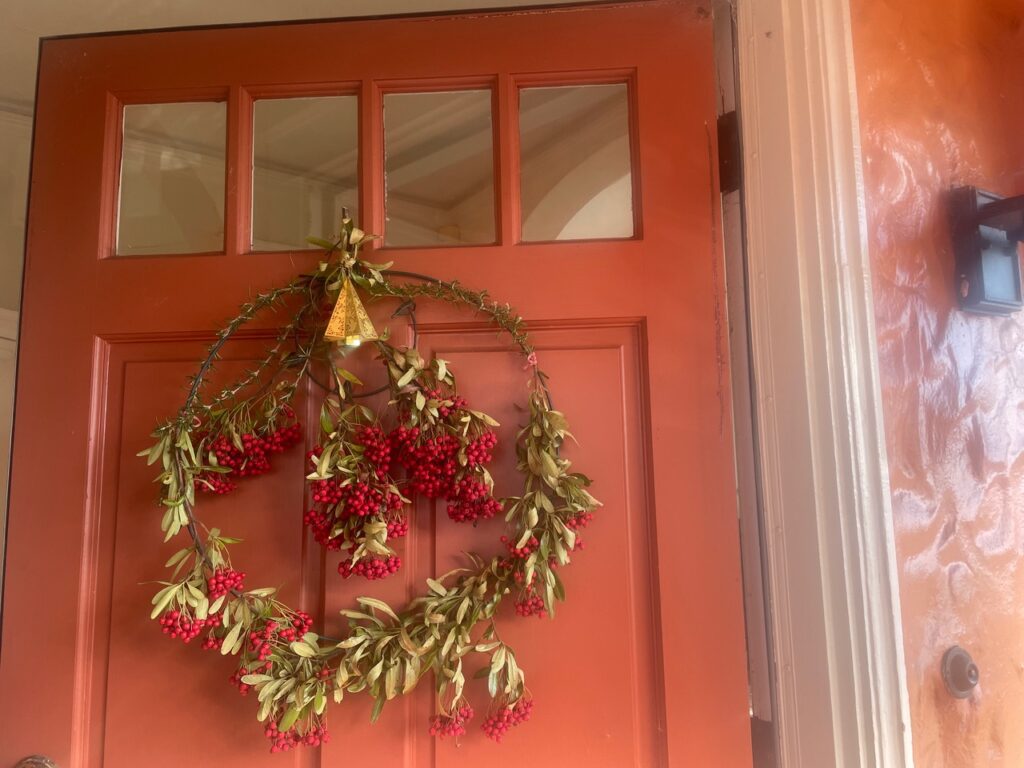 homemade wreath on door