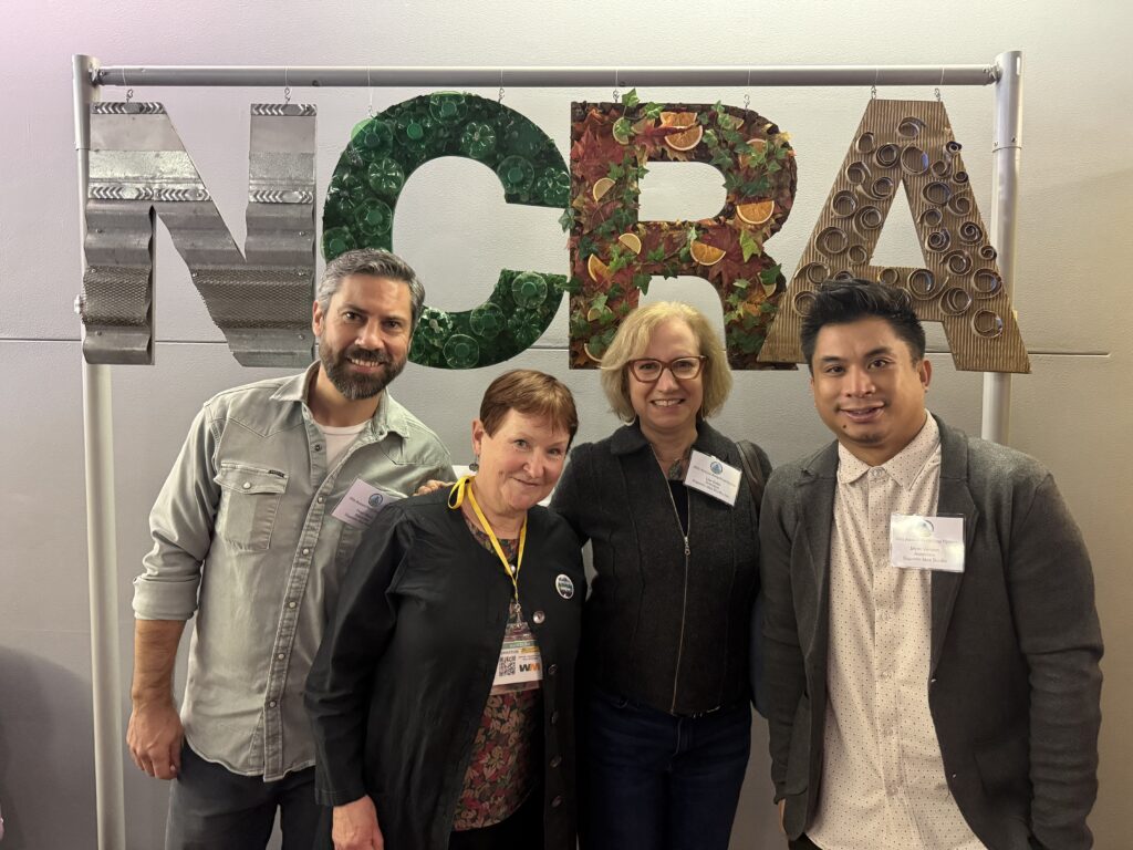 Peter, Nancy, Lisa and Myer in front of NCRA sign